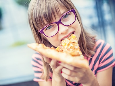 Child teenager with pizza